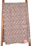 Light brown minky blanket with leaf design.