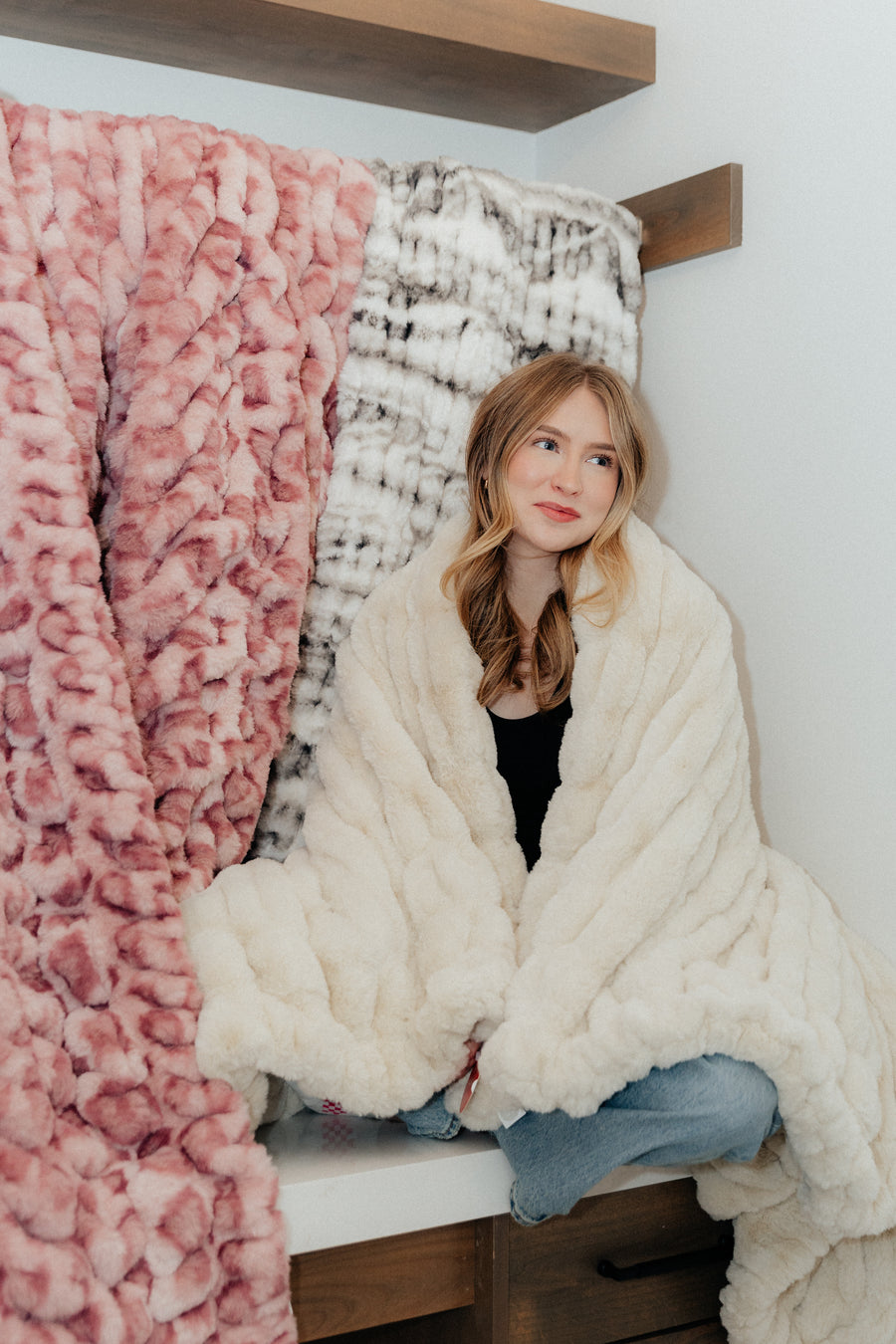 Girl with plush blankets