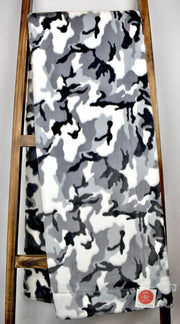 Gray, black, and white camouflage print blanket
